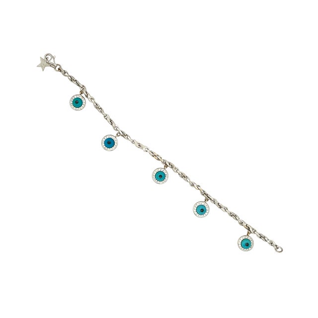A fine vintage 18 k white gold, diamond, and turquoise evil eye bracelet Mae by Tabbah jewelers. The bracelet is in white...