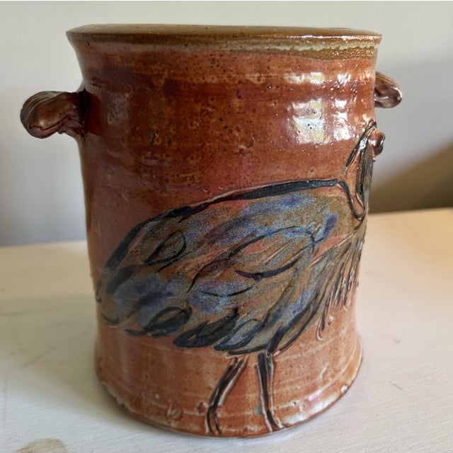 Great studio pottery stoneware wine cooler featuring an etched blue Herron bird. Signed on the bottom.