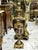 Elegant black porcelain vase featuring rich gold leaf detailing over a deep dark background, creating a bold and refined...