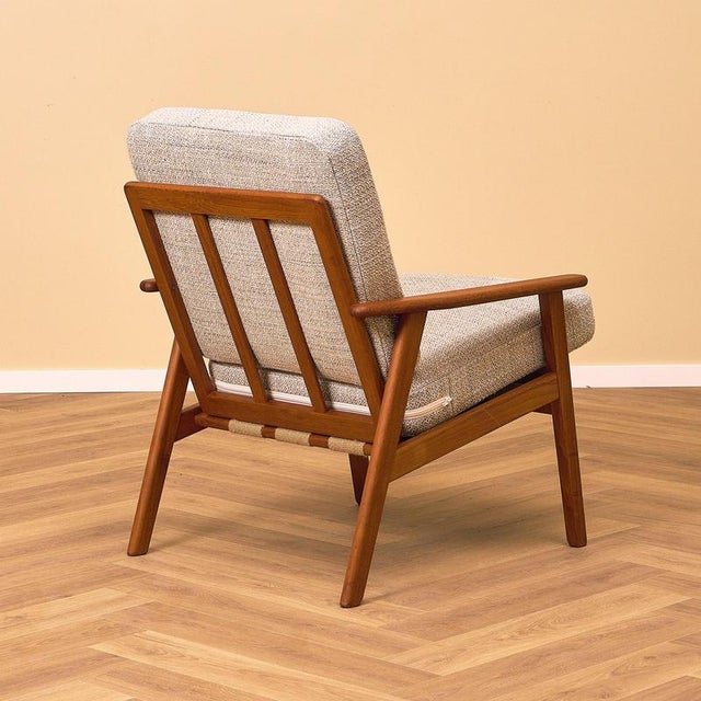 The armchair was manufactured in Denmark in the 1960s. The chair is made of solid teak wood on the structure. The chair...