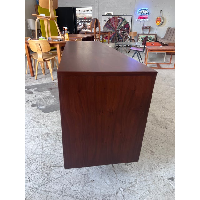 Beautifully refinished walnut credenza, featuring gorgeous wood grain, and sliding doors offering versatile showcase and...