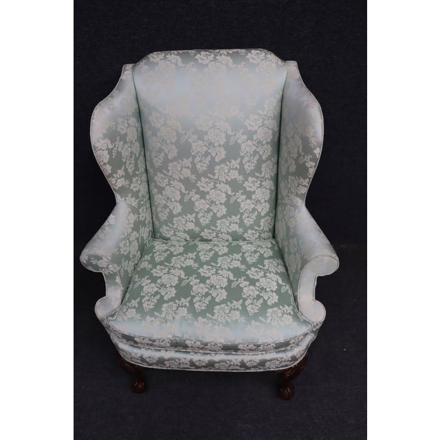 Classic Hickory Chair wingback armchair featuring elegant Chippendale styling and exceptional craftsmanship. The chair is...