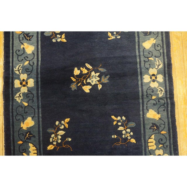 Blue Rectangle 1920s Antique Wool Hand Knotted Pile Rug, Circa Date: 1920s. This exquisite piece captures the refined...