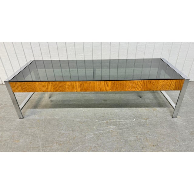 This listing is for a Mid-Century Modern Walnut & Chrome Smoked Glass Coffee Table. Featuring a rectangular smoked glass...