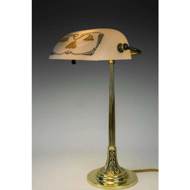 Jugendstil table lamp with new glass shade, Vienna, circa 1908. Brass polished and stove enameled. European Plug (up to...