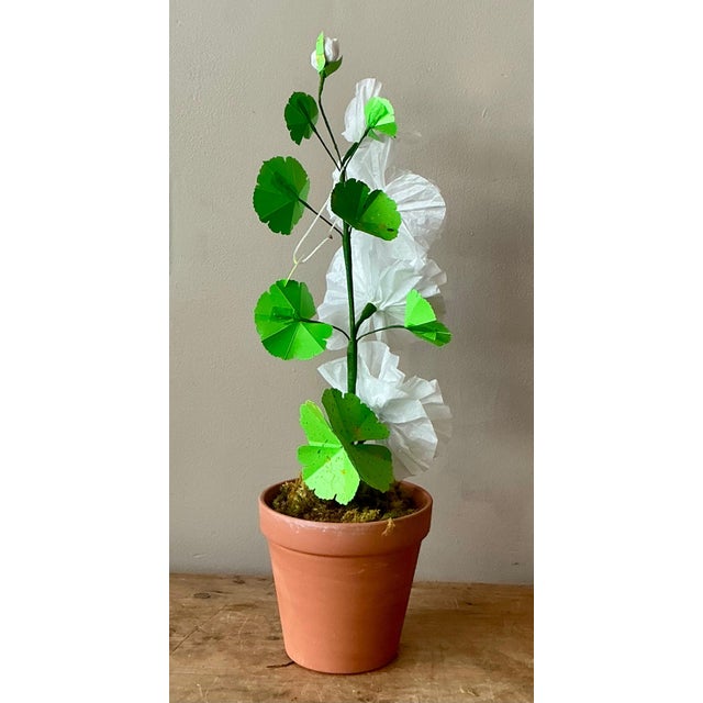 Contemporary hand-rolled paper flowers are a modern, artistic take on traditional floral arrangements. These flowers are...