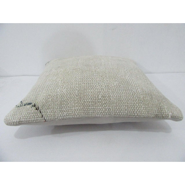 Decorative pillow cover made from a vintage Turkish handknotted rug. Backed with good quality cotton fabric. Pillow...