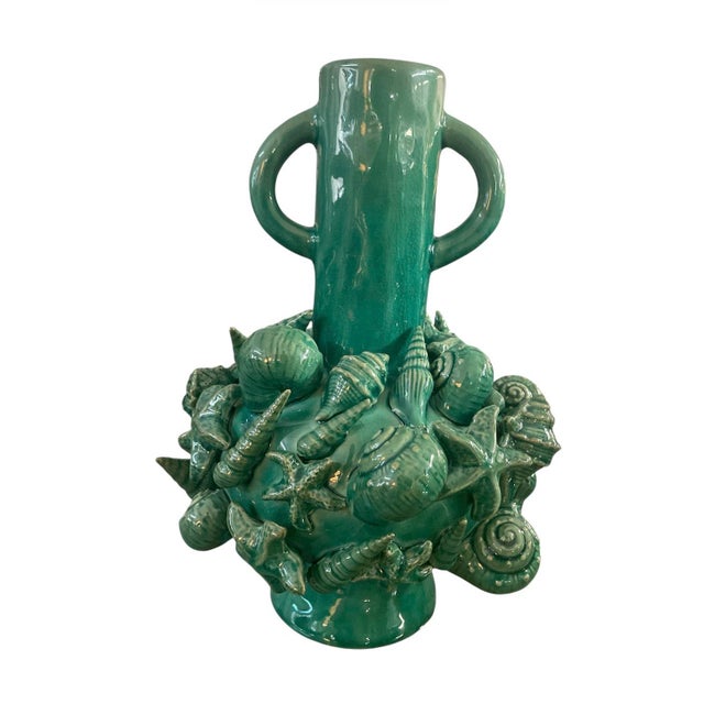 This striking vintage Italian ceramic vase is a masterful blend of classical form and whimsical coastal artistry,...