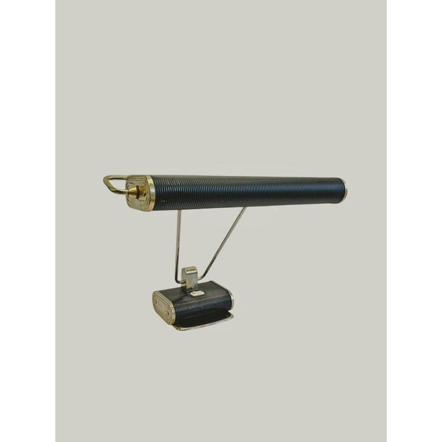 Elegant Art Deco table lamp or desk lamp with a swiveling shade. In the Bauhaus style, designed by Eileen Gray for Jumo,...