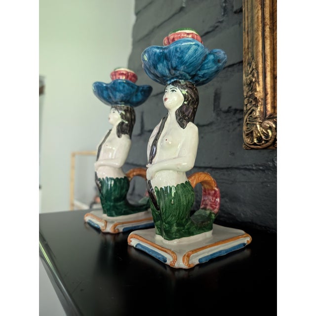 A gorgeous, mirrored pair of contemporary Italian ceramic candlestick holders by luxury homeware brand Les Ottomans....