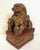 Early-mid 20th century carved, red lacquer and gilt female foo lion, Chinese. Attached to conforming hollow stand base...