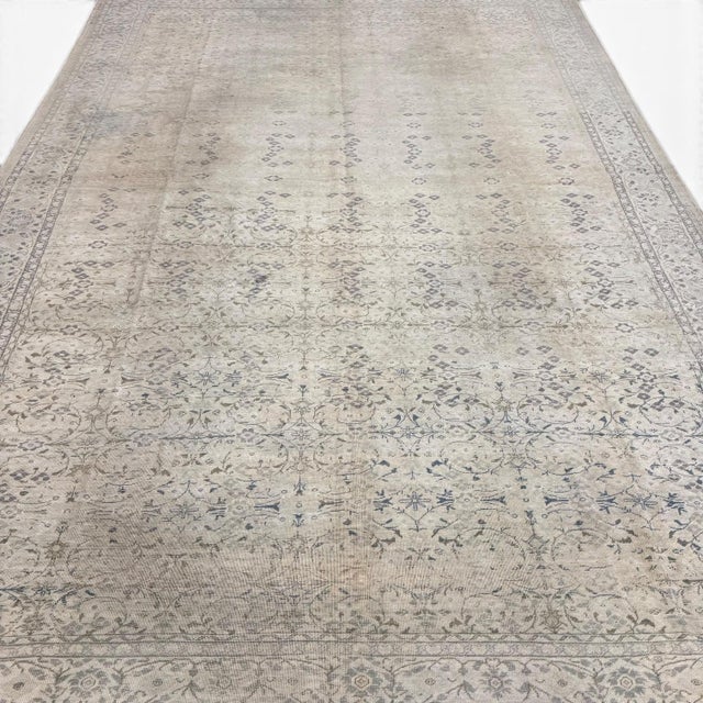 An elegant antique Sivas rug from Turkey, featuring an intricate allover pattern of finely drawn floral motifs in muted...