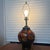 Gorgeous Moorcroft Black Pottery Lamp with Leaves done in Red, Orange, and Yellow tinged with Green. This lamp is a...