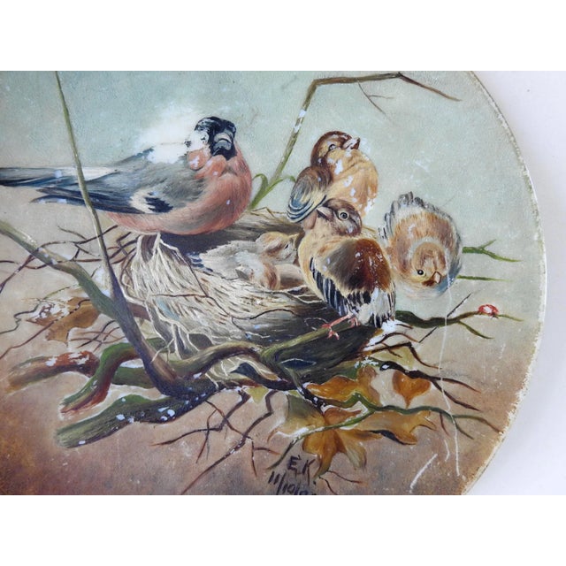 Hand painted nesting birds on milk glass plate. Signed EK and dated 1890 lower right. Areas of paint wear and scratches.