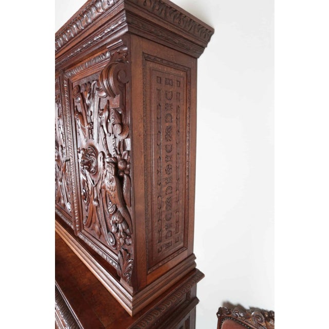 Precise carving from the 19th century in the Renaissance style. Two-part design, with the upper two-door part with...