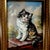 Adorable portrait of a kitten by German artist Inge Gruber-Böhm. Oil painting on wood panel. The portrait captures the...