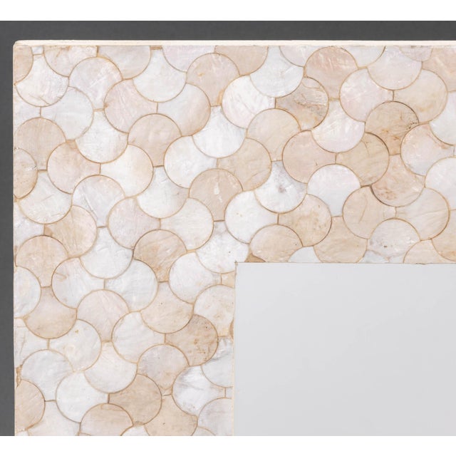 Pair of Modern Capiz Shell Framed Mirrors. Mirror plate: 7.75" H x 7.75" W; frame: 15.75" H x 15.75" W x 0.5" D....
