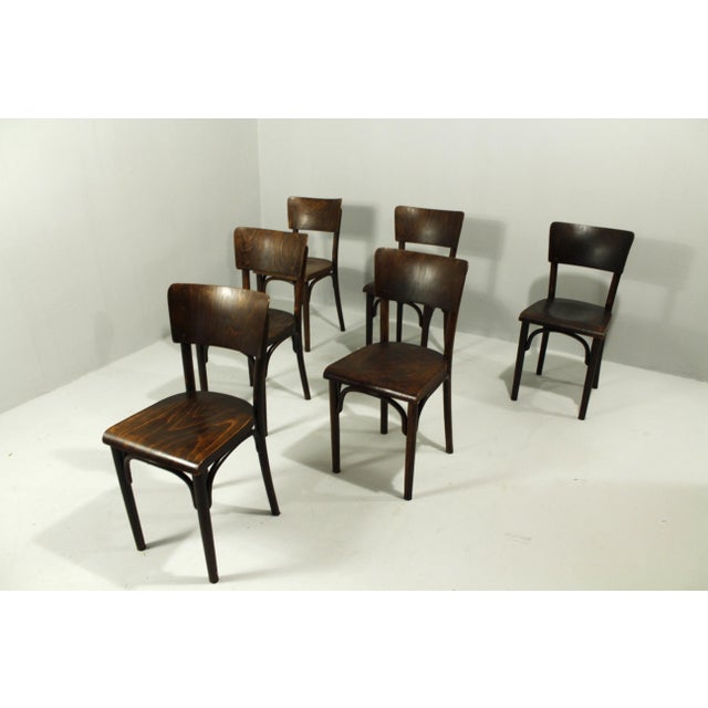 Thonet dining chairs after 90 years of public service with a beautiful patina and ready for further use. This piece has an...