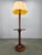 Elegant art deco floor lamp produced in italy during the 1940s. The lamp features a sculptural wooden column with fluted...