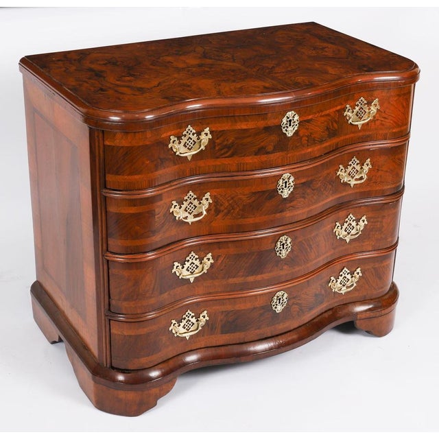 A fine and rare 18th Century serpentine burr walnut Bavarian commode, Circa 1760 in date. This beautiful burr walnut...