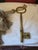 Metal Oversized Brass Key With Tassel For Sale - Image 7 of 7