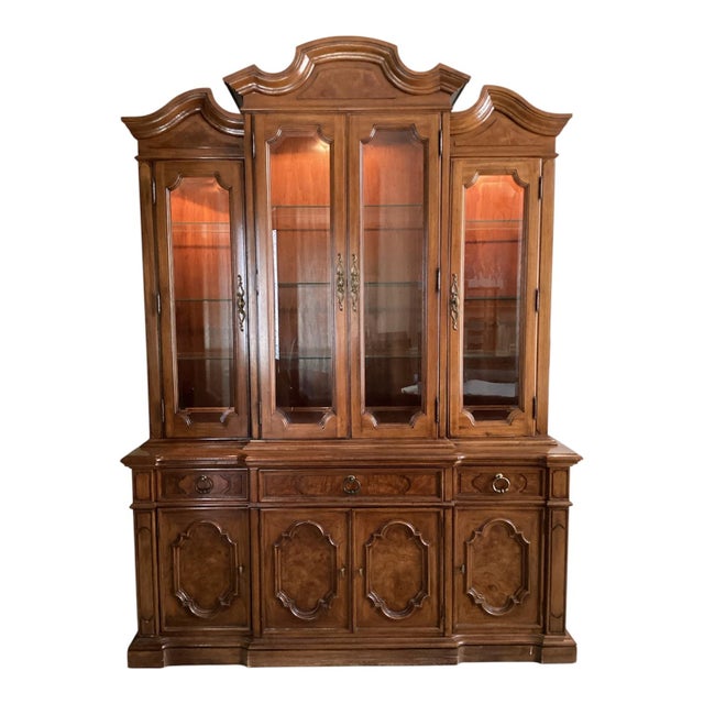 Bring architectural grandeur and timeless craftsmanship into your home with this stunning two-piece breakfront china...