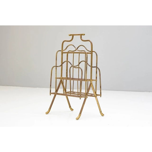 Floor standing brass magazine rack. uk circa 1900 h 70cm x w 40cm x d 34cm this piece is designed in the style of the...
