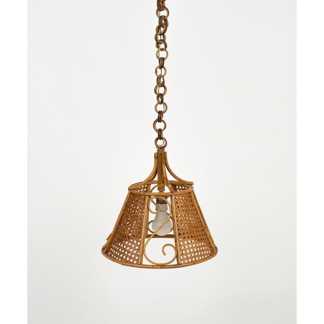 Midcentury beautiful hand-crafted chandelier in rattan and wicker with chain with round rattan links which can be...