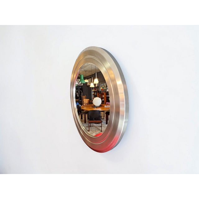 Large circular wall mirror made in the 1970s by Formanova based on a design by Gianni Moscatelli. The frame, mounted on a...