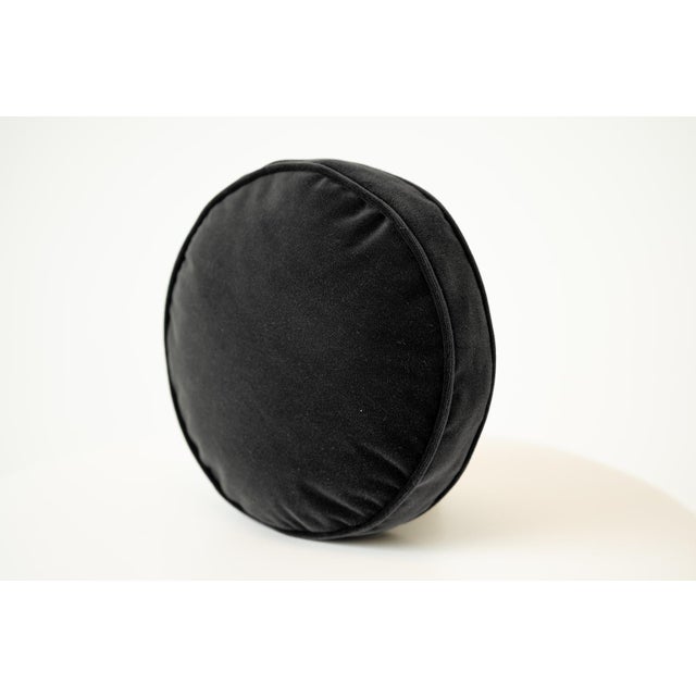 Aesthetic: Sleek and sophisticated, this solid black round throw pillow adds a touch of modern drama to any seating...