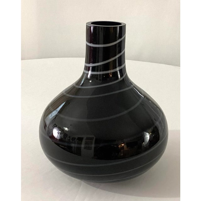 MCM-American handblown-decanter shaped vase in black glass with a white swirl Ground and finished lip and pontil Note-...