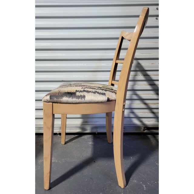 A set of 9 Mid-Century Modern dining chairs designed by Paul T. Frankl for Brown-Saltman of California. Eight side chairs...