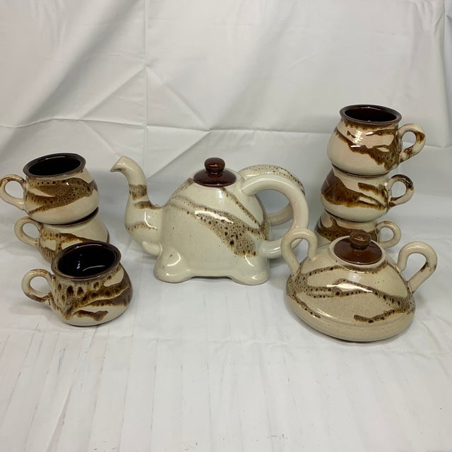 Elevate your daily ritual with this stunning Vintage Studio Pottery Tea Set. Hand-crafted with an organic, sculpted...