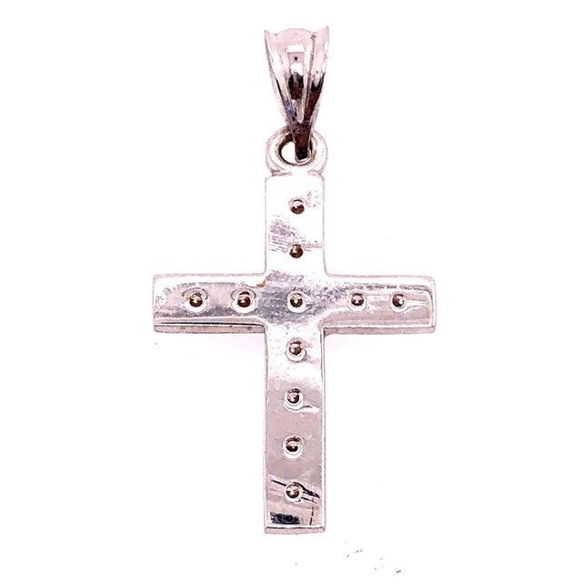 14 Karat White Gold Religious / Crucifix Pendant with Eleven Round Diamonds. 0.25 Total diamond weight 5.1 grams total...