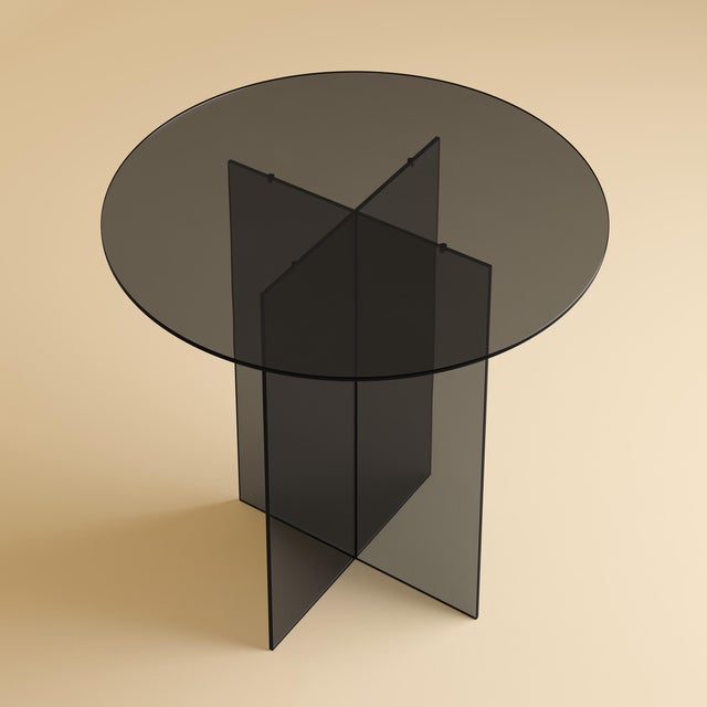 The Iki is a smoked glass dining table, a table scaled for a room and its company in which the material is also the...