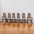 An elegant set of six Mid-Century Modern dining chairs, attributed to American Furniture Co., crafted from rich wood with...