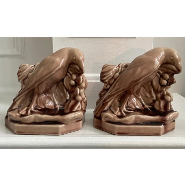 Beautiful pair of Rookwood art pottery raven bookends marked 1946. Their color is hard to define: not quite brown, not...