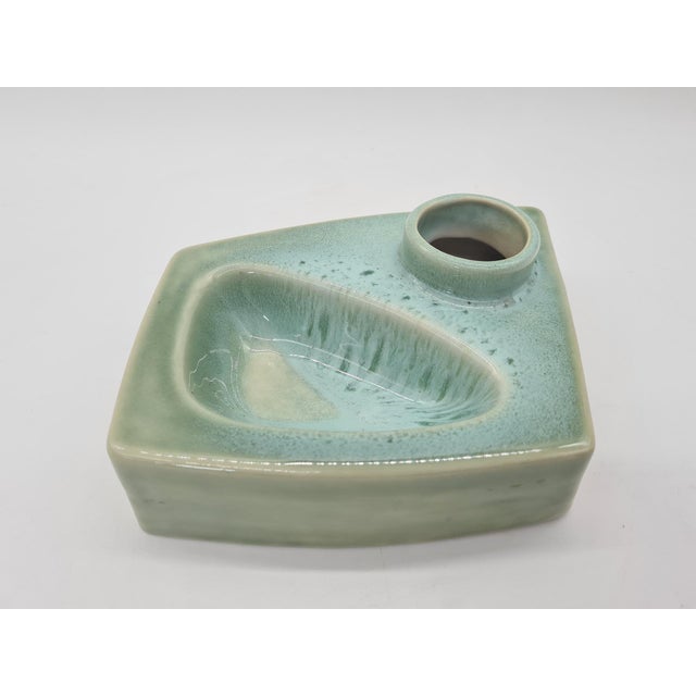 An original modernist piece made of glazed ceramic in shades of green. Its distinctive, organic form draws inspiration...