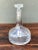 This vintage clear glass decanter brings understated mid-century elegance to any bar cart or dining table. The flared,...