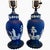 A striking pair of vintage cobalt blue jasperware table lamps featuring crisp white neoclassical relief decoration. These...