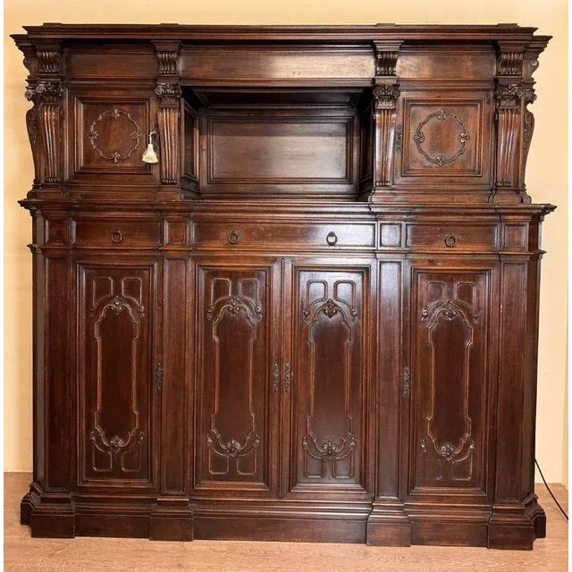 large Renaissance-style notary's cabinet in solid walnut from the 19th century front opening with 6 molded leaves and 3...