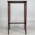 A charming and beautifully crafted early 20th-century English Edwardian side table, finely constructed in mahogany and...