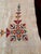 This charming vintage tablecloth features a geometric folk inspired cross stitch design. It is a heirloom stitched...