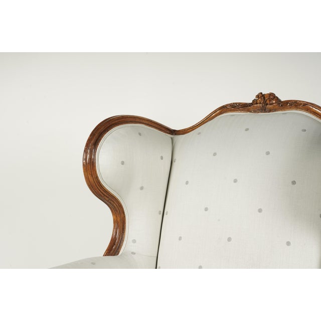 Description: An Antique French Provincial-Style Bergere a l'Oreilles covered with later grey polka dot fabric Dimensions:...