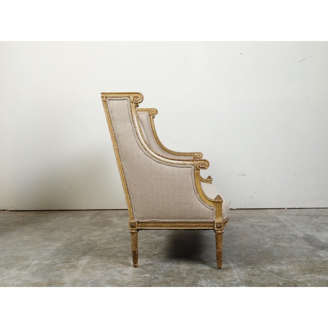 19th Century French 19th Century Louis XVI Style Giltwood Wingback Settee with Carved Motifs For Sale - Image 5 of 10
