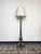 Beautiful antique French brass floor lamp available. Featuring an urn base with six feet and a fluted central shaft,...