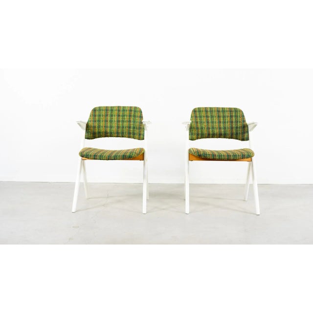 Painted beech frame “Trivia” armchairs designed by Bengt Ruda and made by Nordiska Kompaniet. Marked with Nordiska...
