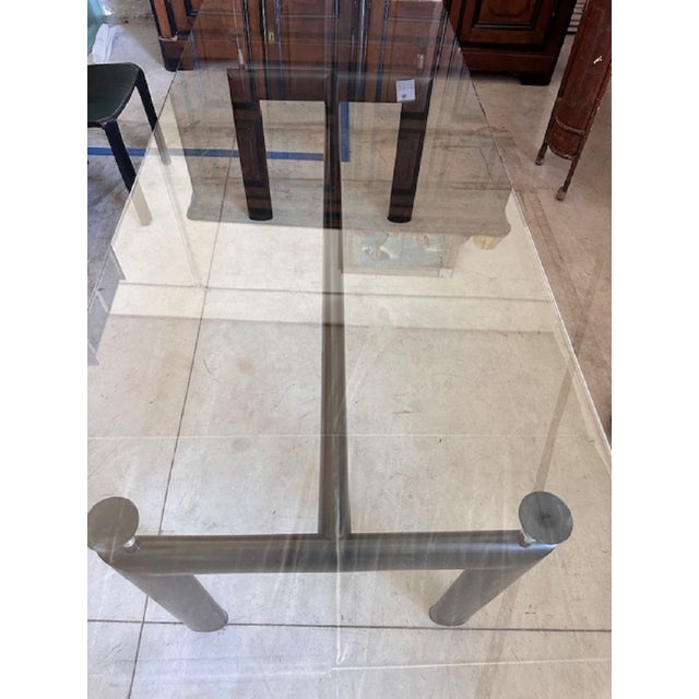 Iconic LC6 Le Corbusier table for Cassina. Along the edge of the glass there are light chips highlighted in the photos....