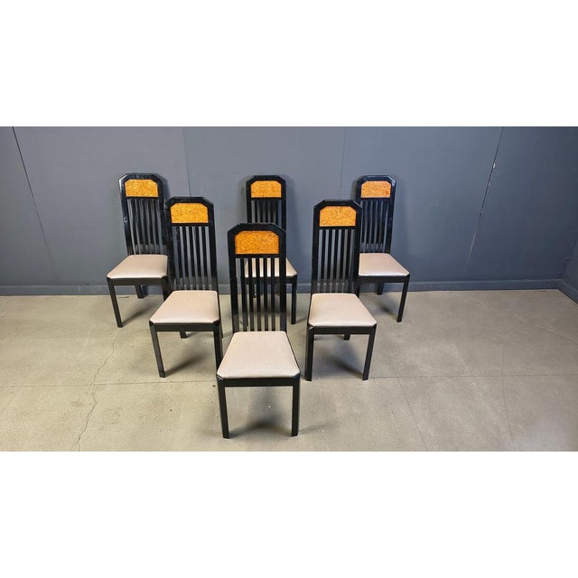 Set of 6 black lacquered wooden dining chairs with inserted burl wood panels and grey simili leather seats. They can also...
