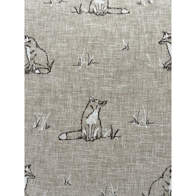 A charming handmade pillow cover crafted from Pindler Foxie in Natural, an embroidered textile featuring beautifully...